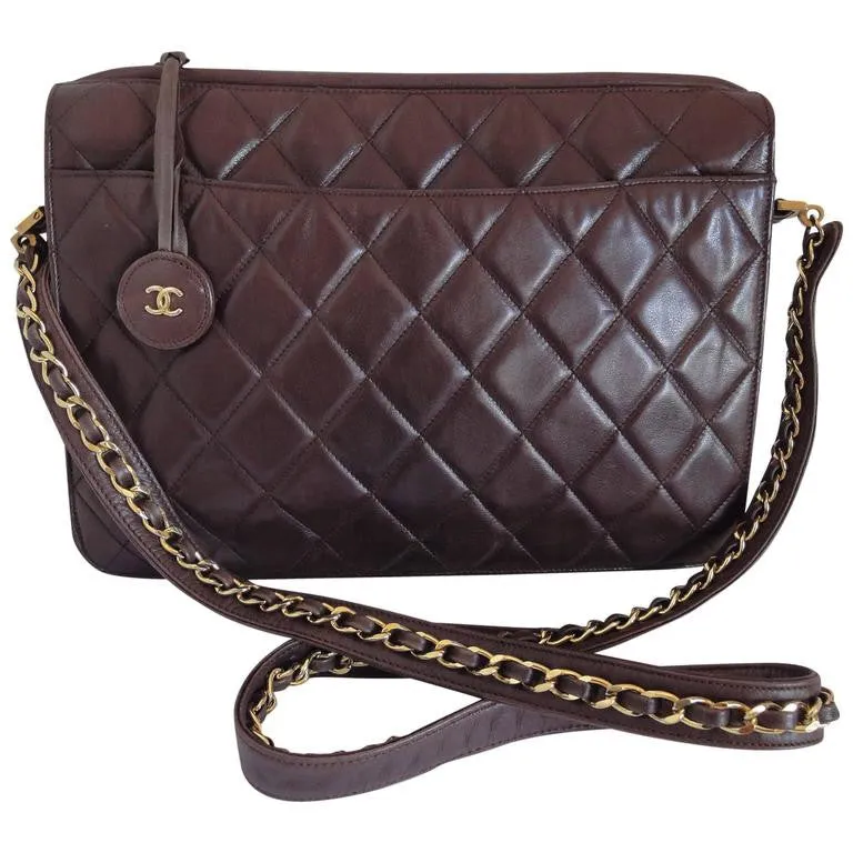 80's vintage Chanel dark brown quilted lambskin shoulder bag with CC motif and built-in chain shoulder strap. Rare Chanel purse