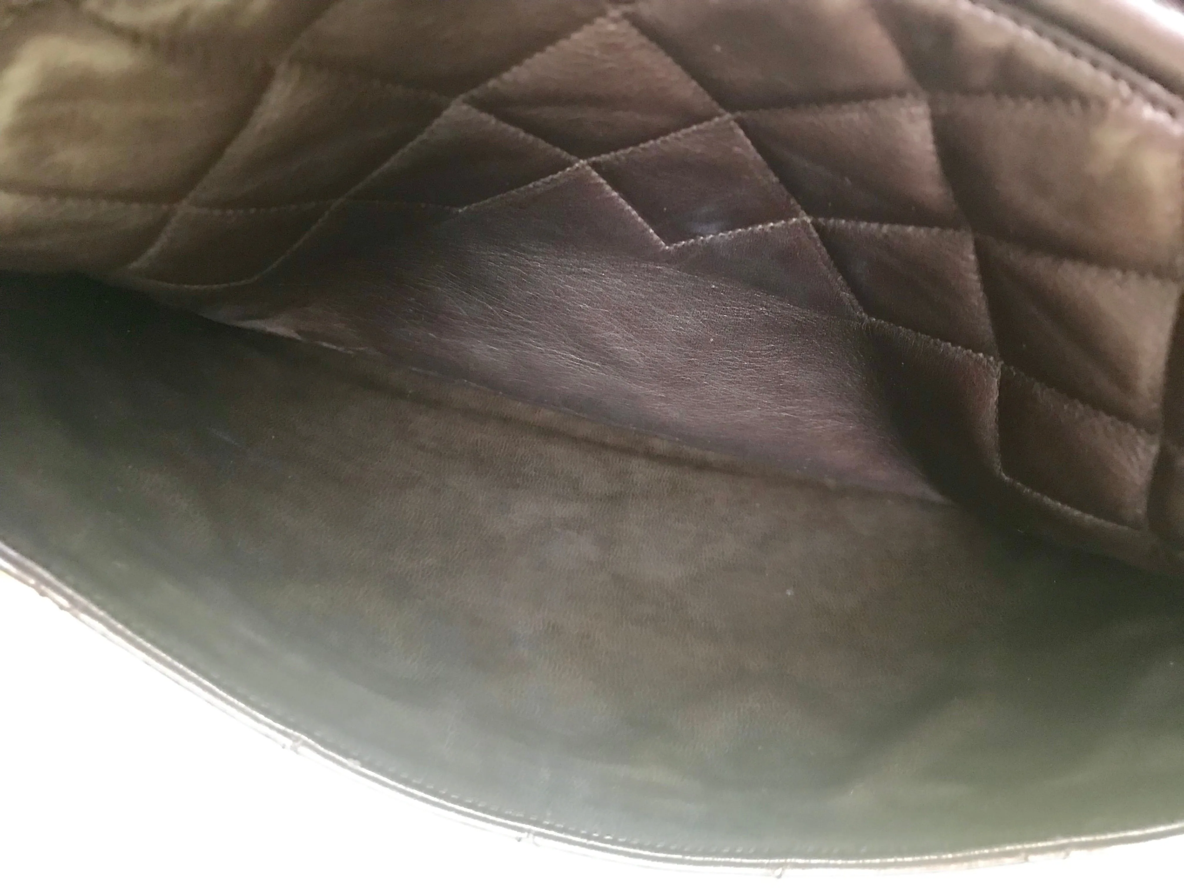 80's vintage Chanel dark brown quilted lambskin shoulder bag with CC motif and built-in chain shoulder strap. Rare Chanel purse