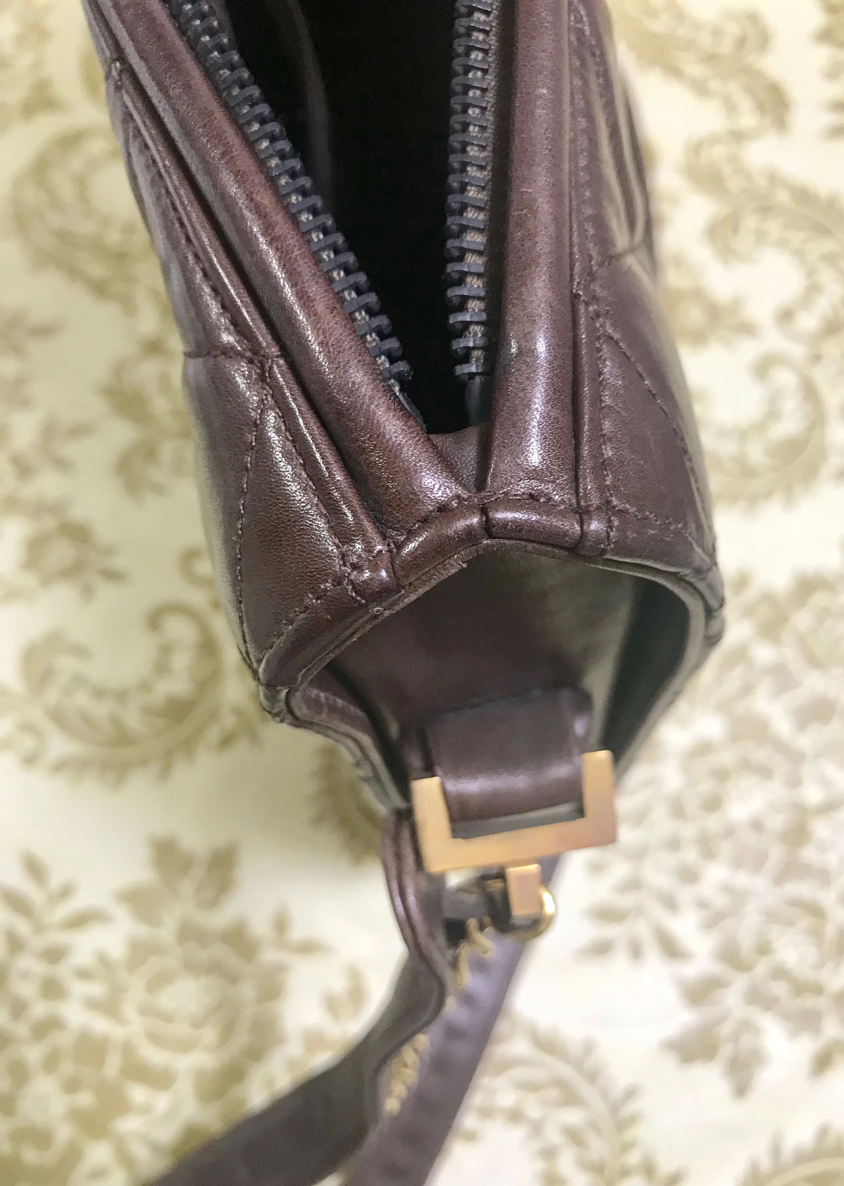 80's vintage Chanel dark brown quilted lambskin shoulder bag with CC motif and built-in chain shoulder strap. Rare Chanel purse
