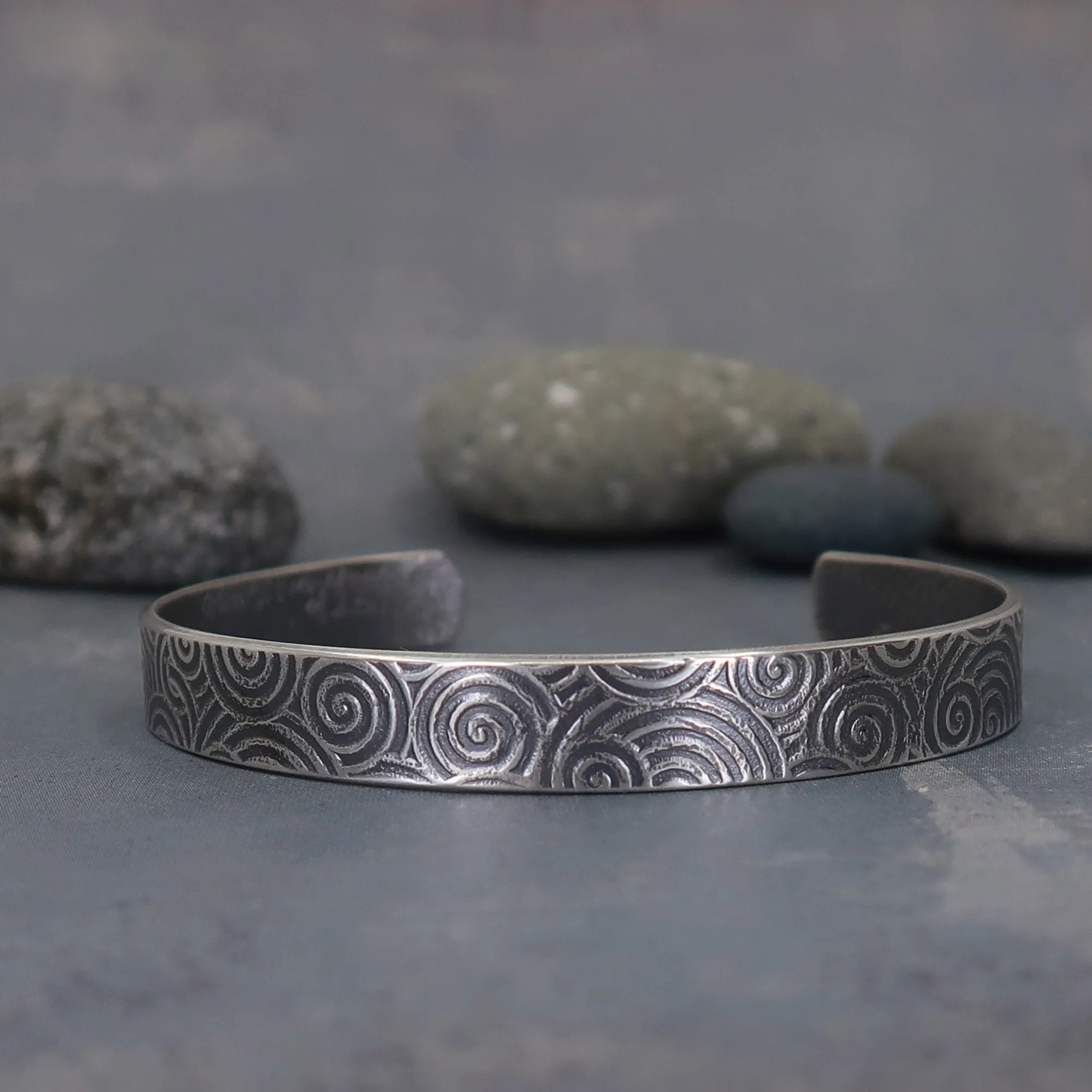 Sterling silver cuff bracelet with spiral pattern