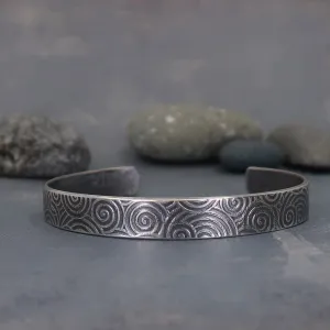 Sterling silver cuff bracelet with spiral pattern