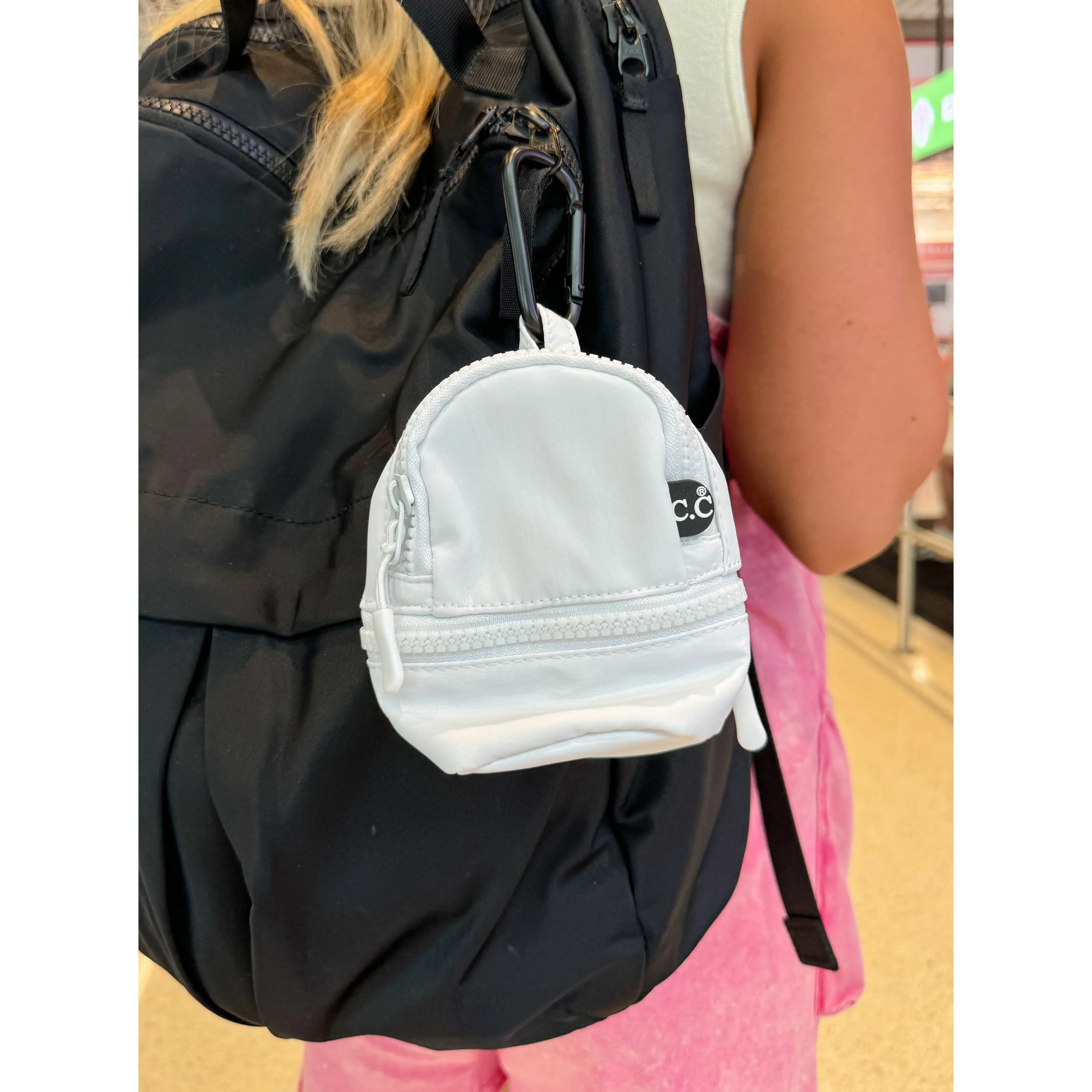 The TINY C.C Backpack Pouch (multiple colors)